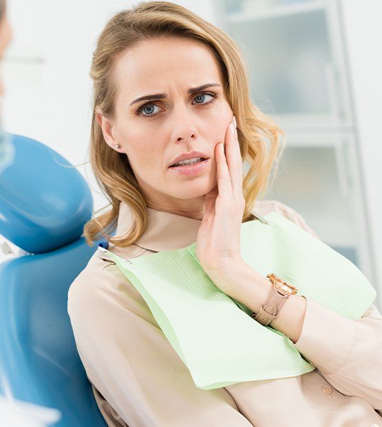 Concerned woman discussing periodontal disease with he dentist