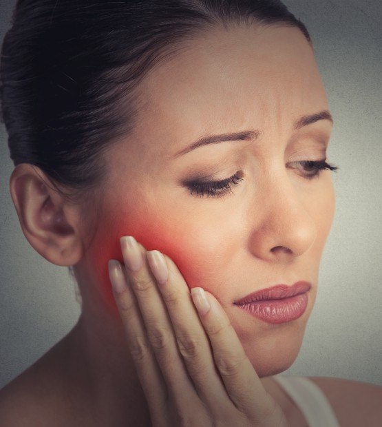 Woman in pain before emergency dentistry treatment