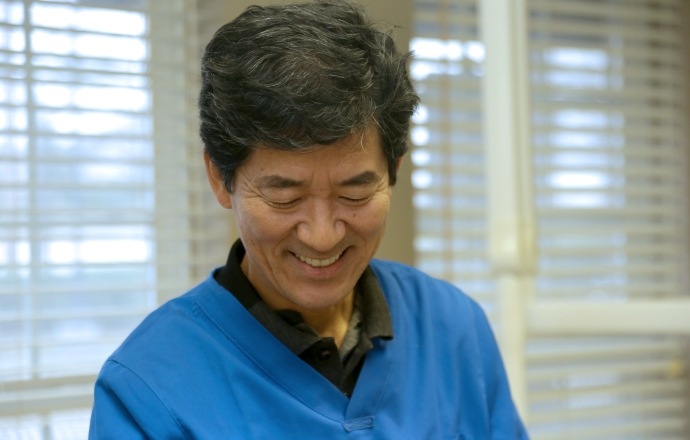 Doctor Song smiling at dental patient in Flower Mound