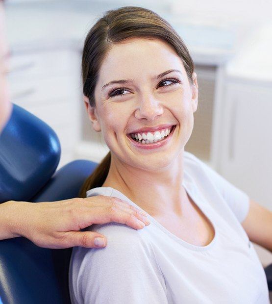 Woman smiling after root canal treatment