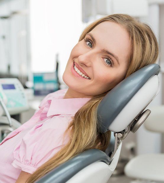 Woman at dental office relaxed thanks to sedation dentistry