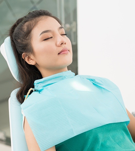 Relaxed patient in dental chair after sedation dentistry