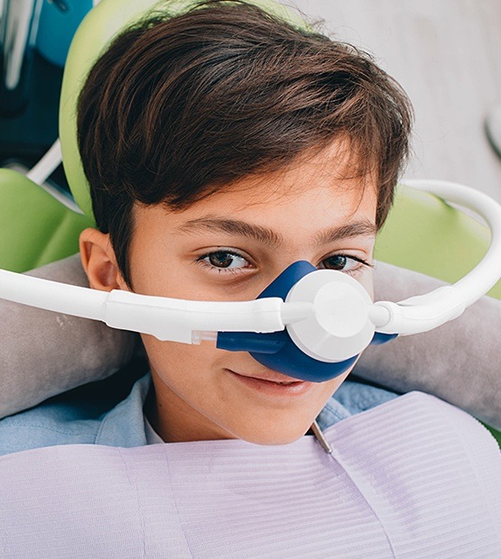 Young child with nitrous oxide dental sedation mask