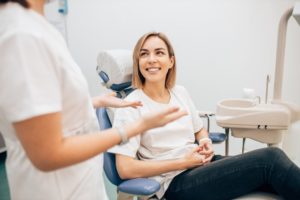dentist answering patient's questions in flower mound