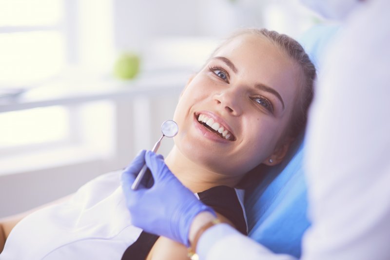 Dental patient showing smile full of white teeth