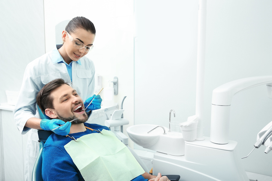 dentist working with patient in office
